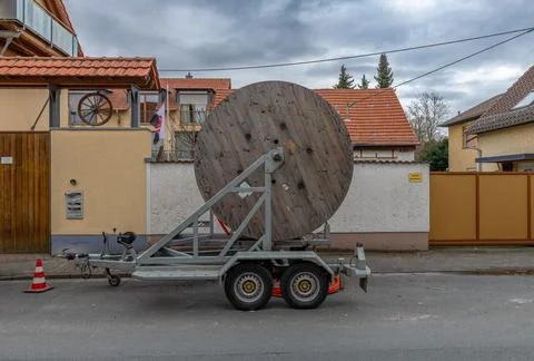 Fiber optic cable reel on a roadside trailer Stock Photos