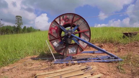 Fiber optic cable reel spinning during installation in Brazil Stock Footage 341996801