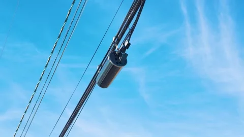 Fiber Optic Cable Splice Enclosure on Overhead Utility Lines Vídeo Stock 348254640
