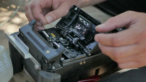 Fiber optic cable splice machine closeup Stock Footage 112242405