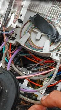 Fiber optic cable splicing and colorful telecommunications 스톡 사진