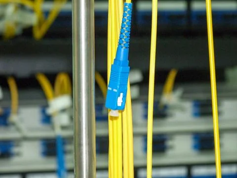 Fiber optic cables connected in a data center Stock Photos