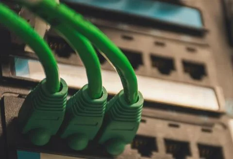 Fiber Optic Cables Connected to Network Equipment in Data Center Stock Photos