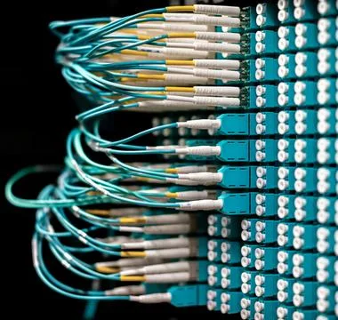 Fiber Optic Cables Connected to Network Equipment in Data Center 스톡 사진