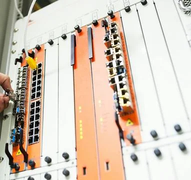 Fiber Optic Cables Connected to Network Equipment in Data Center Stock Photos