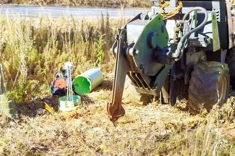 Fiber optic cables laid with help of a trencher cable plow tractor Stock Photos