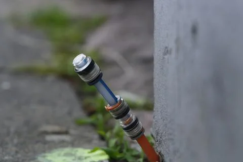 Fiber optic connection was installed between the footpath at paving stones .. Stock Photos