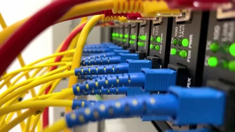 Fiber optic converter, fiber optic and ethernet cable plugged into the switch Stock Footage 148951151