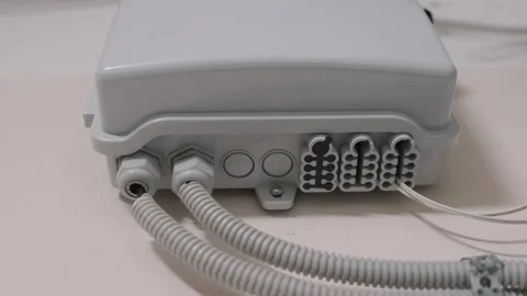 Fiber Optic Distribution Box with Cables Installed Indoors | Bottom-up View Stock Footage 330318007