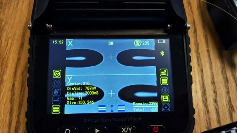 Fiber optic fusion splicer screen displaying digital alignment and connection Stock Footage 334747914