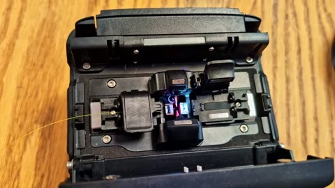 Fiber optic fusion splicing machine connecting data cables for high-speed Stock Footage 332375243