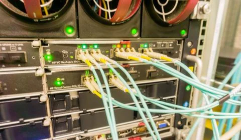 Fiber optic light waveguide on a switch in the Data Center Stock Photos