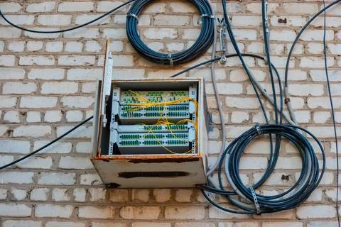Fiber Optic Patch Panel On Apartment Building Wall Fiber Optic Patch Panel... Foto stock