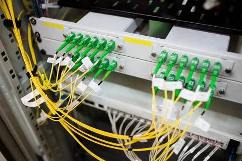 Fiber optic patch panel is being shown in flat design, with yellow cables and 스톡 사진