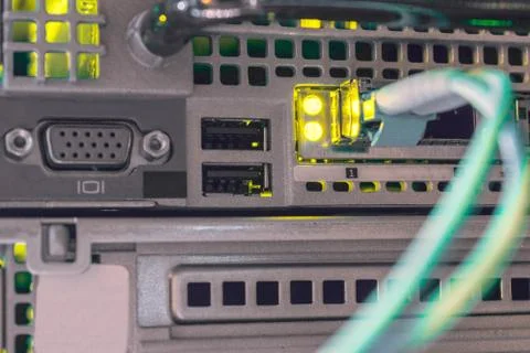 The fiber optic patchcord is connected to the modular interface of a powerful 库存照片