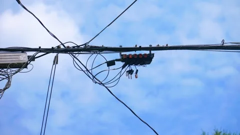 Fiber optic splice closure box on aerial utility line grid Stock Footage 339764941