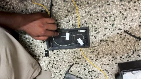 Fiber Optic Technician Performing Precision Cable arrangement In Equipment for Stock Footage 340957424