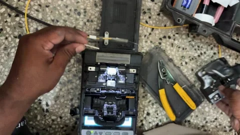 Fiber Optic Technician Performing Precision Cable Alignment In Fusion Splicing Stock Footage 340957472