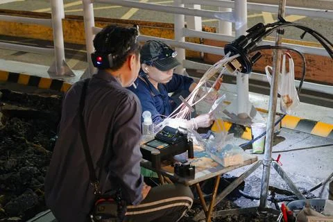 Fiber Optic Technicians Splicing Cable at Night Road Construction Taipei Photos