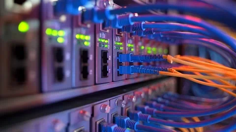 Fiber Optical cables connected to an optic ports and Network cables Stock Footage 141043273