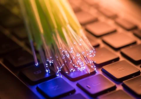 Fiber optical on computer keyboard background Stock Photos