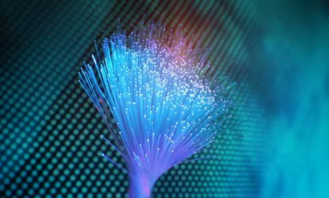 Fiber optics network cable on technology background Stock Photos