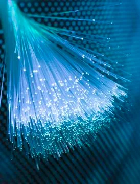 Fiber optics network cable on technology background Stock Photos