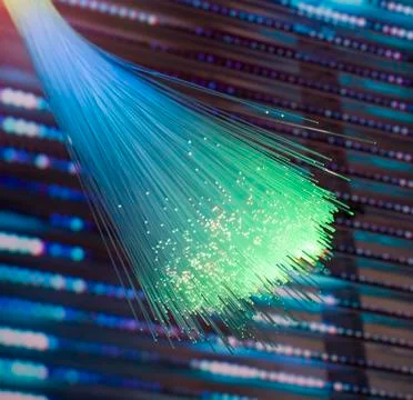 Fiber optics network cable on technology background Foto stock