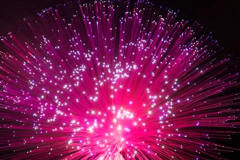 Fiber optics network cable on technology background Stock Photos