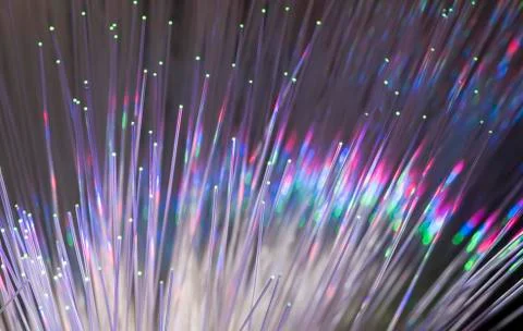 Fiber optics network cable on technology background Stock Photos