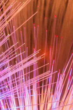 Fiber optics network cable on technology background Stock Photos
