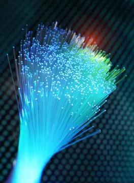 Fiber optics network cable on technology background Stock Photos