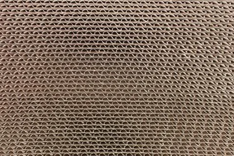 Fiberboard background. The texture of fibreboard. Pressed cardboard close-up Stock Photos