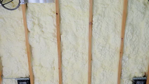 The fiberglass insulation installed between wooden wall studs in the house Stock Footage 309585334