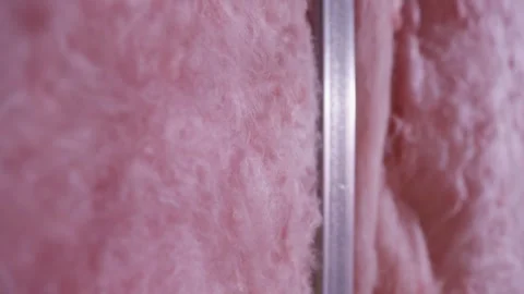 Fiberglass Insulation with Metal Stud Close-Up Stock Footage 314030684
