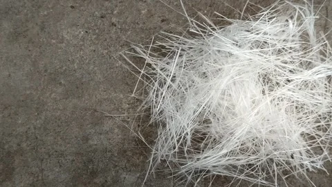 Fiberglass stack on a gray background Stock Footage 322879737