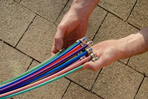 Fibre optic cable in the hands of a man Stock Photos