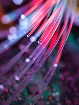 Fibre optics used to send data darting past computer circuit board Stock Photos