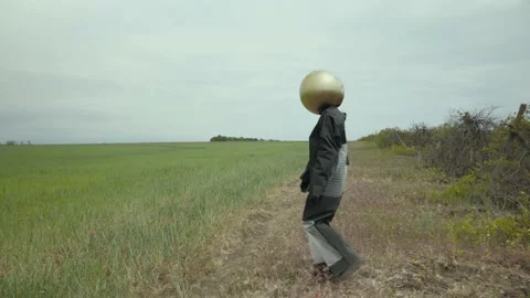 Fictional character emerges from the thicket of a vineyard. man in a black suit Stock Footage 156786271