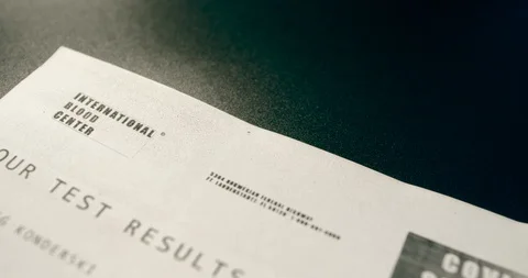 Fictitious document covid-19 negative analysis report with blood test tube Stock Footage 127590404