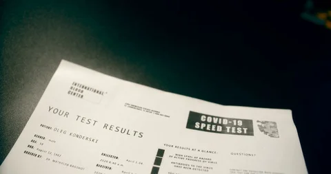 Fictitious document covid-19 positive analysis report with blood test tube Stock Footage 127590796