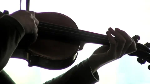 A Fiddle Player Playing Her Violin Against a Window. Close Up. Stock Footage 201262971