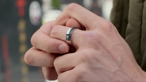 Fiddle with the ring worn on the finger Stock Footage 261642045