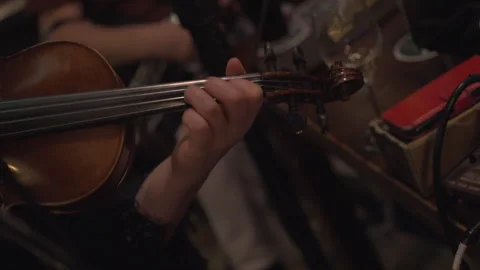 Fiddle violin musician playing notes in Irish pub traditional  music session Stock Footage 331045276