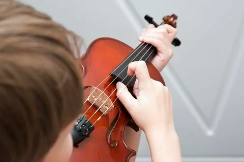 Fiddlestick on the strings of a violin Pizzicato Stock Photos