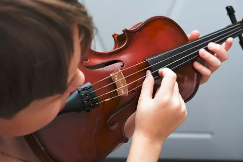 Fiddlestick on the strings of a violin Pizzicato Stock Photos