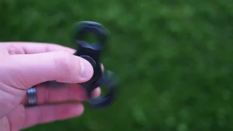 Fidget Spinner in a Hand 4K Stock Footage 75919513