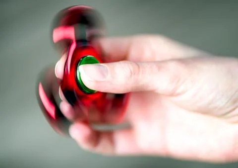 Fidget spinner in hand Stock Photos