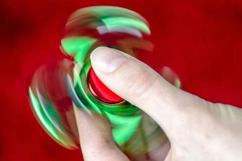 Fidget spinner in hand Stock Photos