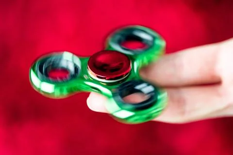 Fidget spinner in hand Stock Photos